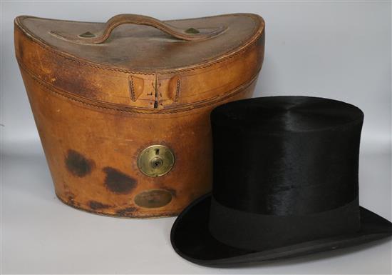 A top hat in leather case
